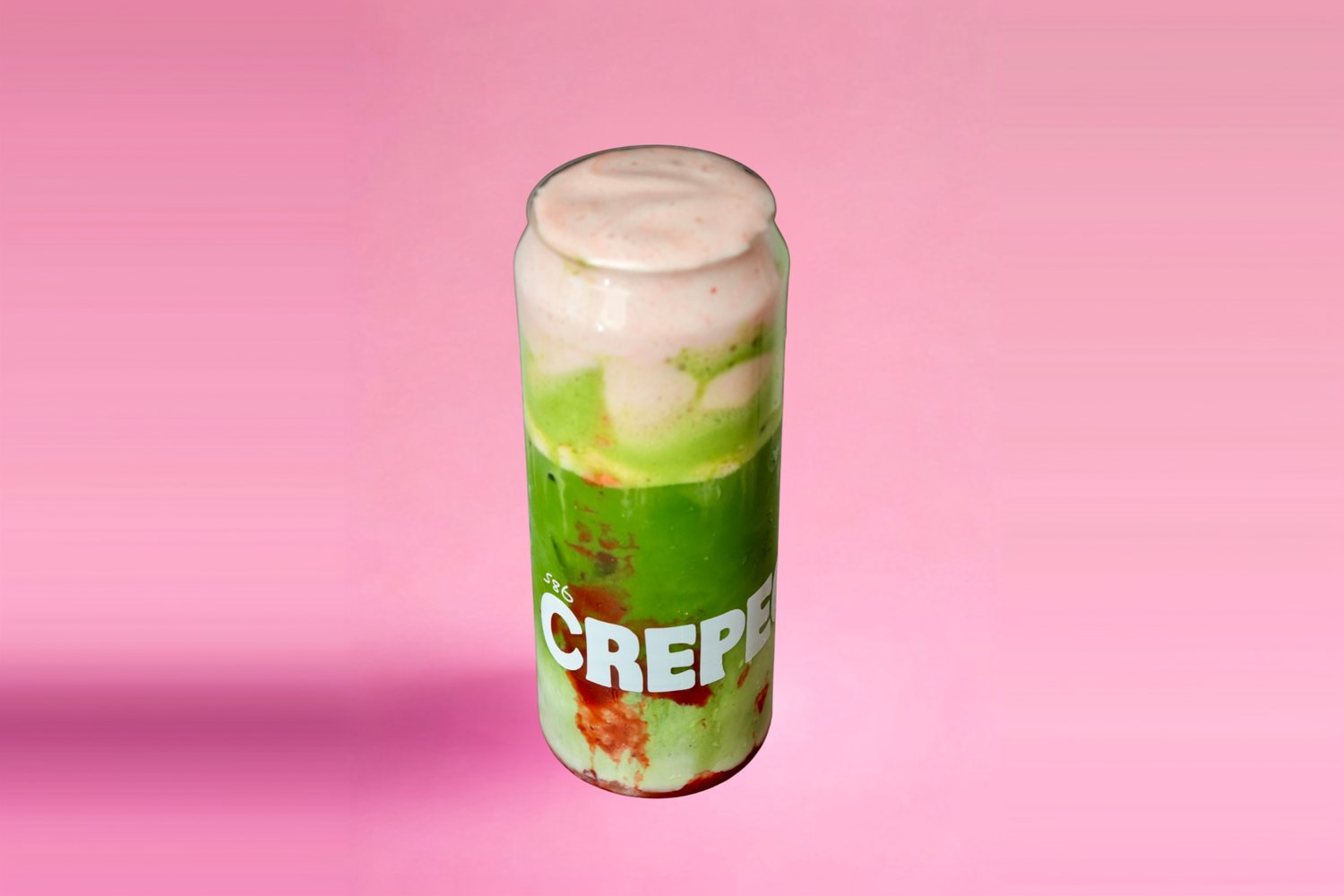 Iced matcha topped with strawberry cold foam in a Crepeccino can glass